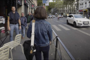 Lise, visually impaired person, walking in the street